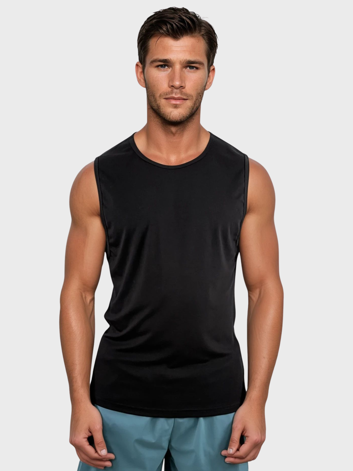 Man wearing a black sleeveless shirt against a plain background