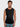 Man wearing a black sleeveless shirt against a plain background
