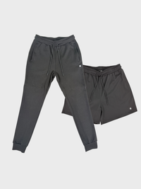 Gray sweatpants and shorts set on a light gray background