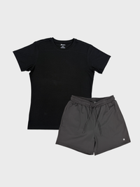 Black t-shirt and gray shorts on a light gray background