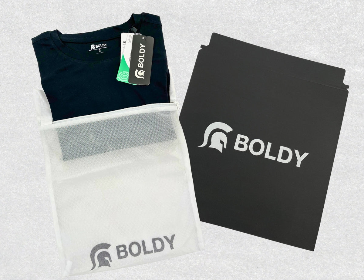 Black t-shirt with Boldy branding on packaging and a black folder.